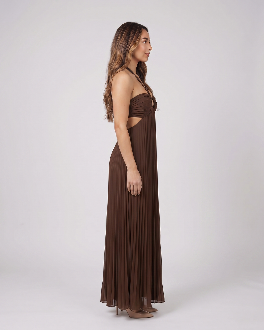 Side view of dark brown halter pleated with cutout maxi dress