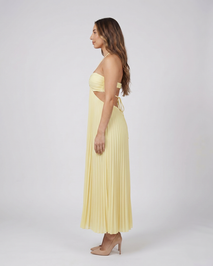 Side view of light canary halter pleated with cutout maxi dress