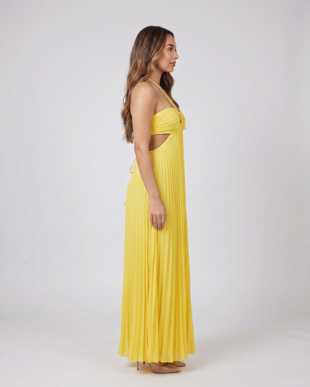 Side view of yellow halter pleated with cutout maxi dress