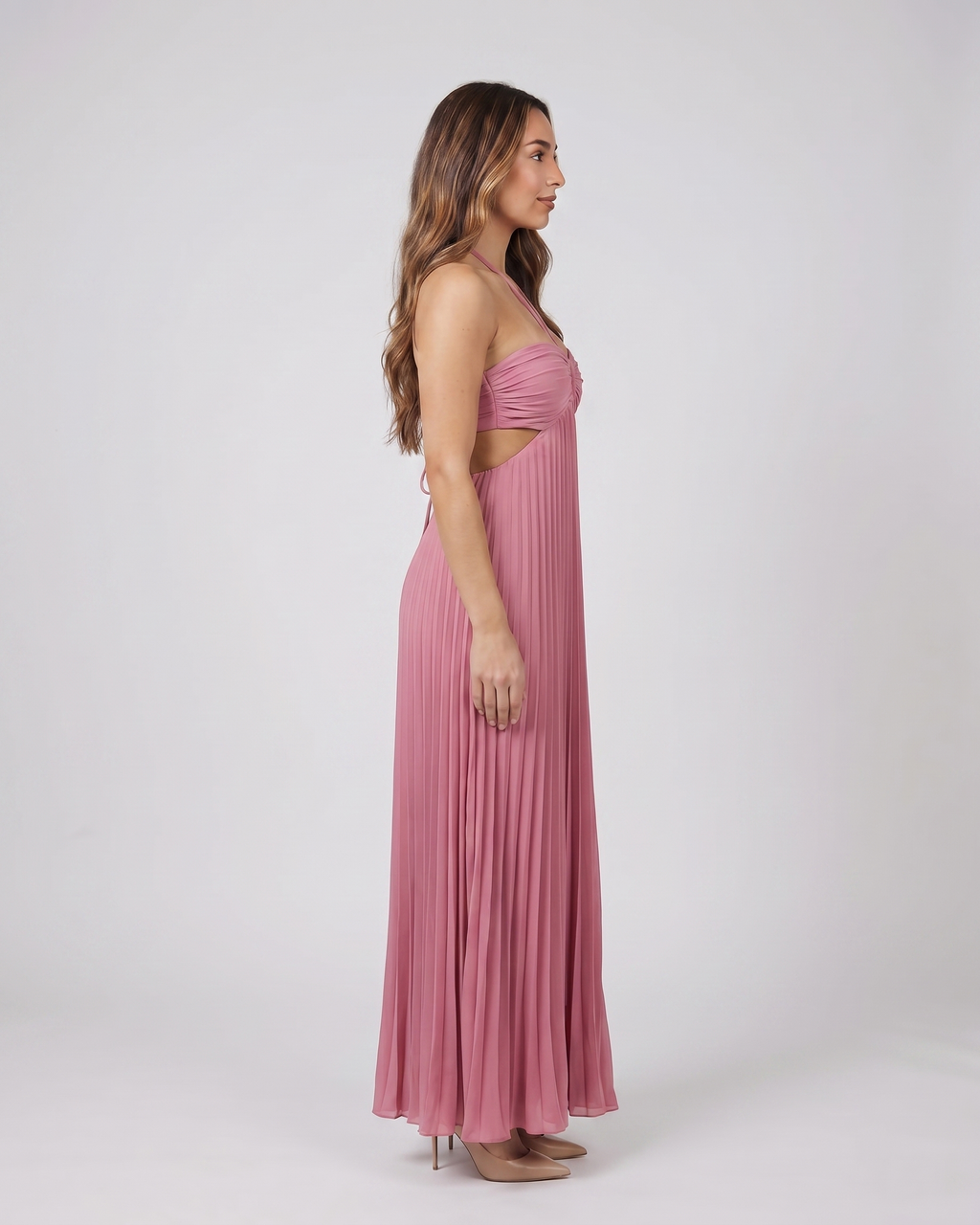 Side view of pink halter pleated with cutout maxi dress