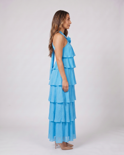 Side view of blue halter rosette tiered maxi dress