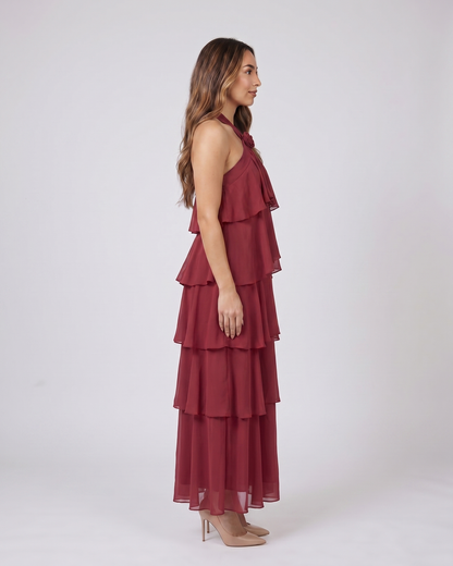 Side view of red halter rosette tiered maxi dress