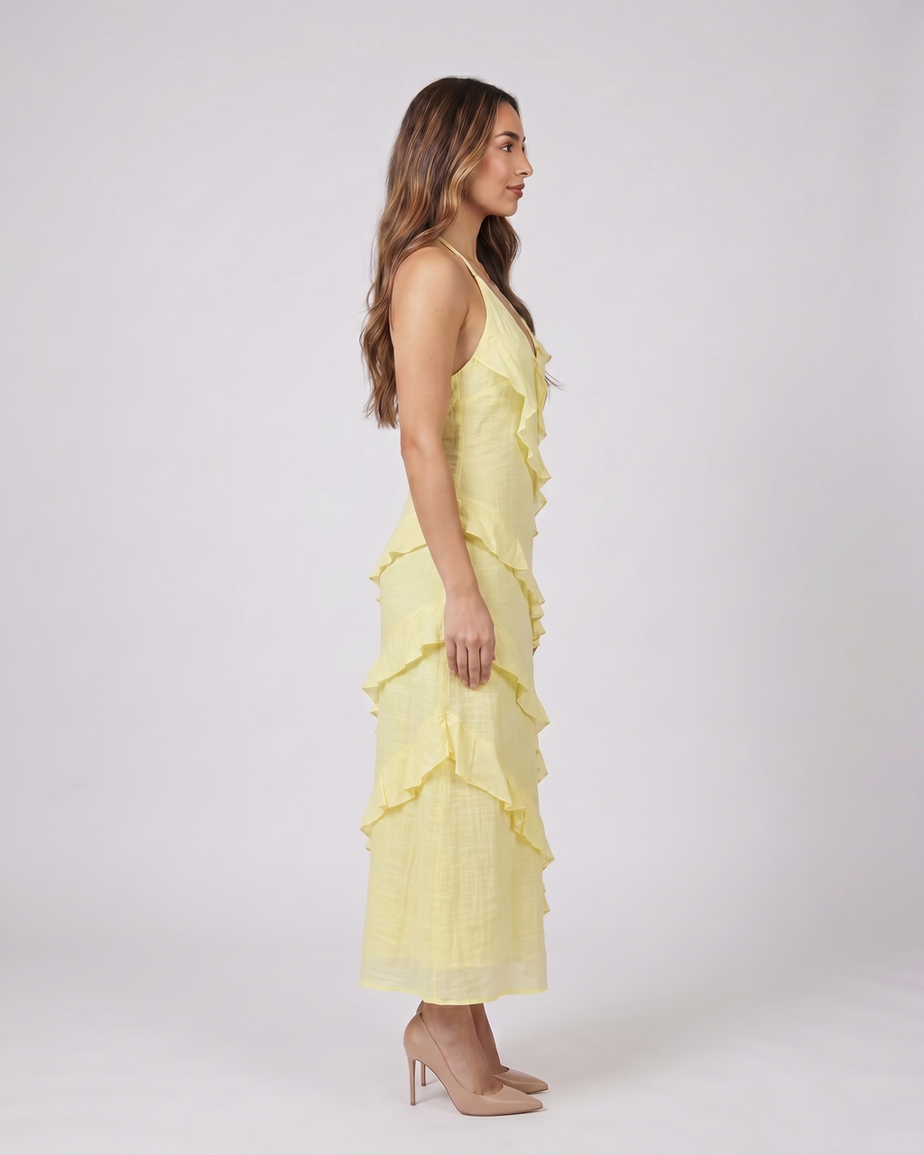Side view of lemon halter v neck tiered ruffle maxi dress