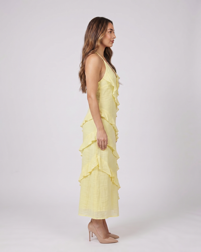 Side view of lemon halter v neck tiered ruffle maxi dress