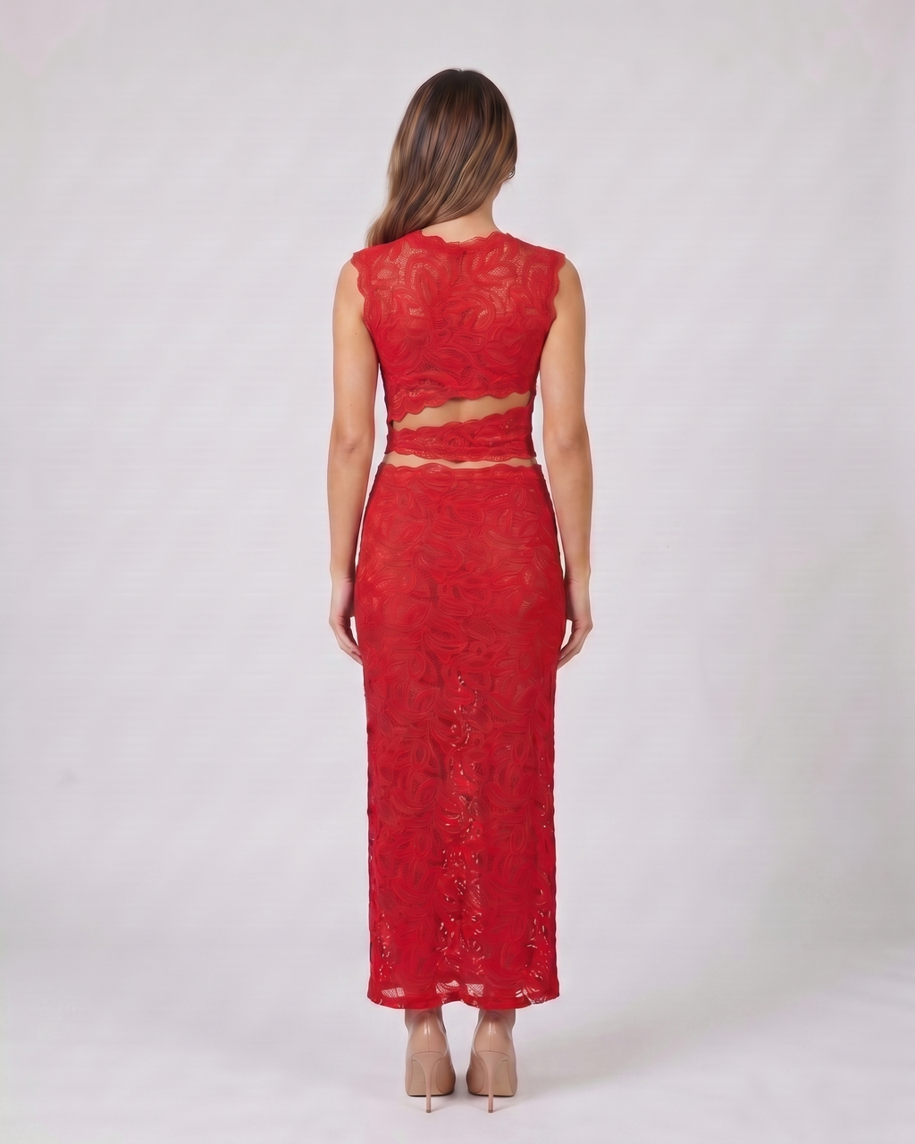 Back view of red high neck lace cutout maxi set showing solid back top with waist open-panel detail continuing from the sides