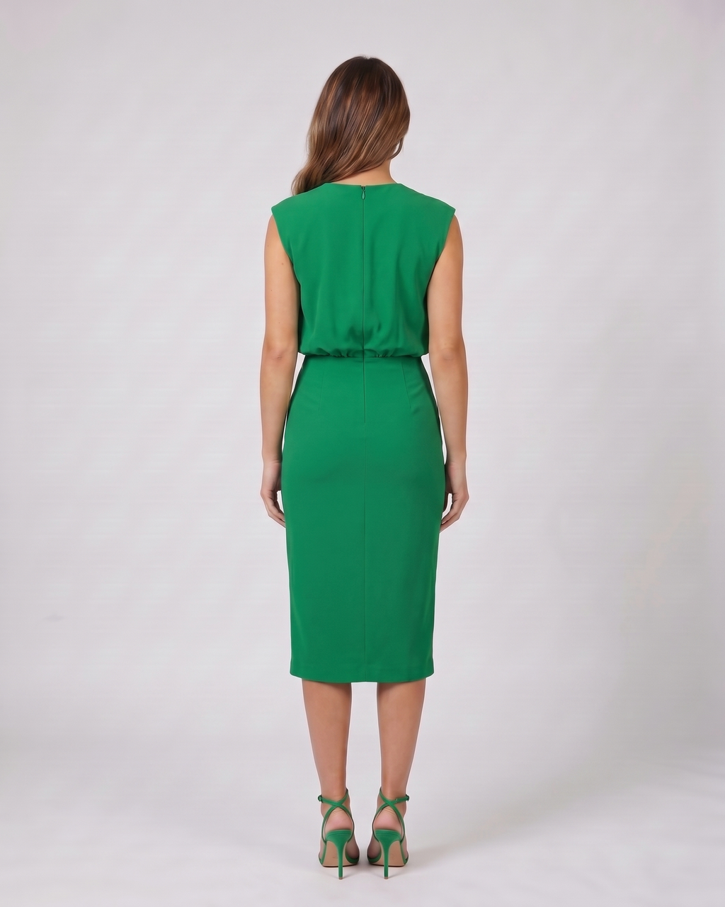 Back view of green keyhole neck ruched side midi dress showing solid back