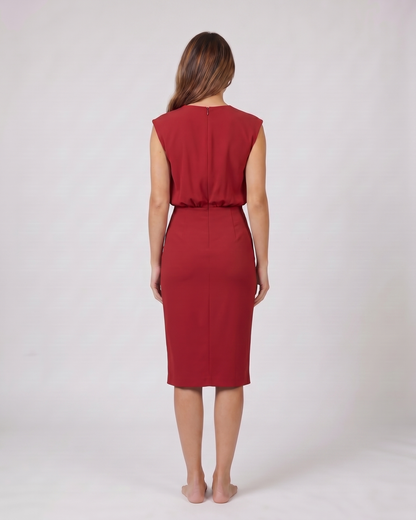 Back view of red keyhole neck ruched side midi dress showing solid back