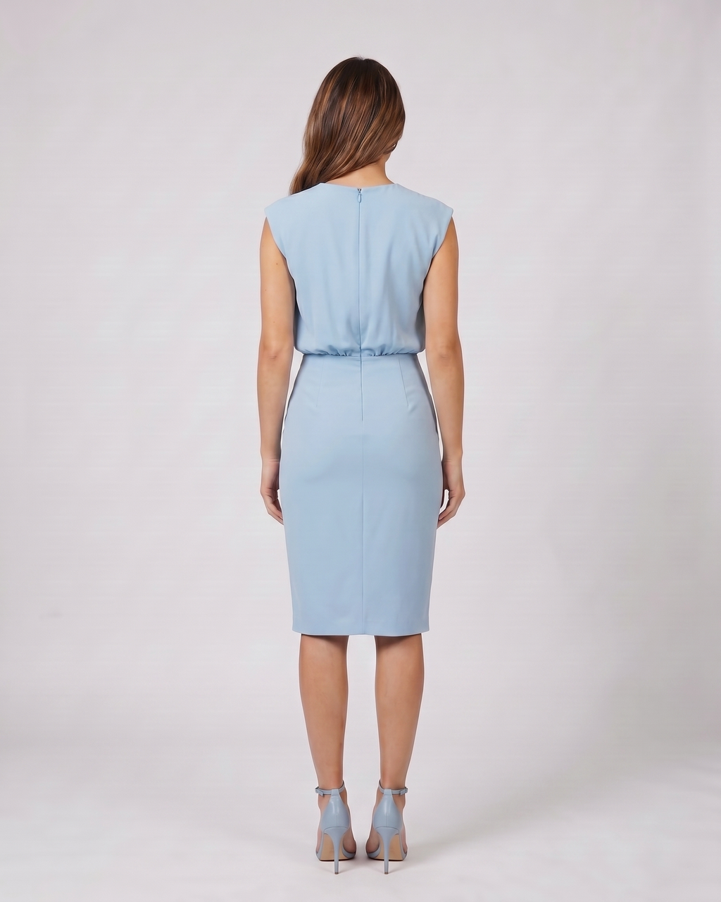 Back view of light blue keyhole neck ruched side midi dress showing solid back