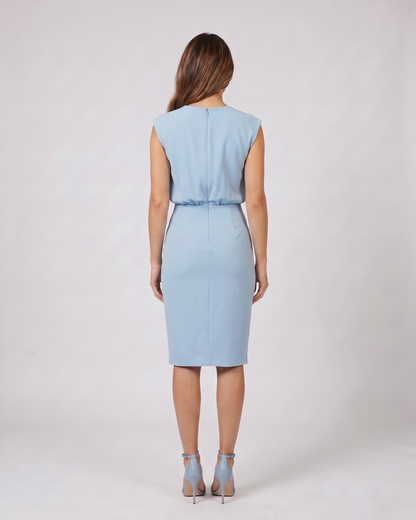 Back view of light blue keyhole neck ruched side midi dress showing solid back