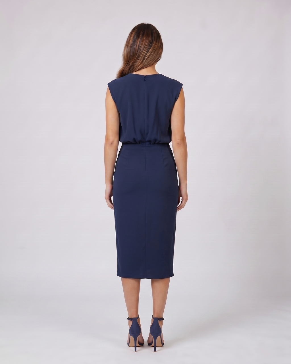 Back view of navy blue keyhole neck ruched side midi dress showing solid back