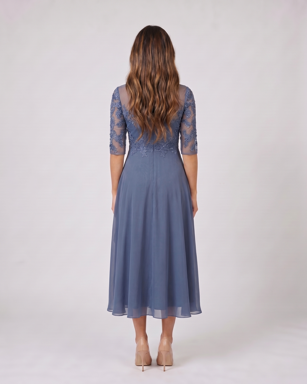 Back view of blue lace 3/4 sleeve round neck midi dress showing solid back with lace overlay on upper bodice