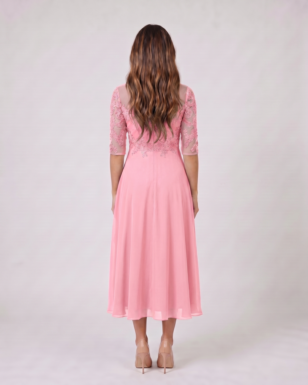 Back view of pink lace 3/4 sleeve round neck midi dress showing solid back with lace overlay on upper bodice