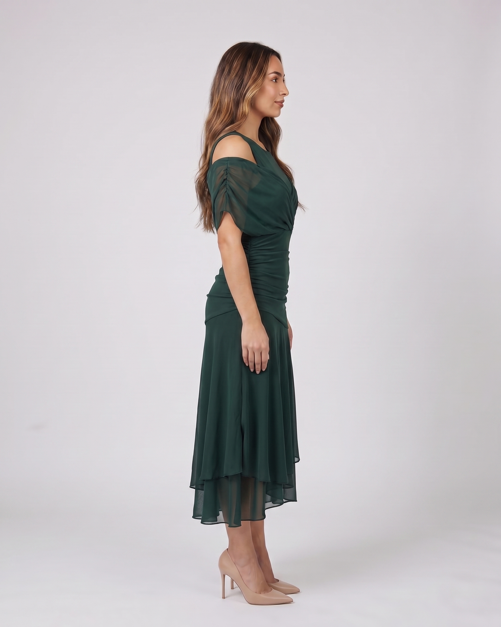 Side view of green off shoulder draped midi dress