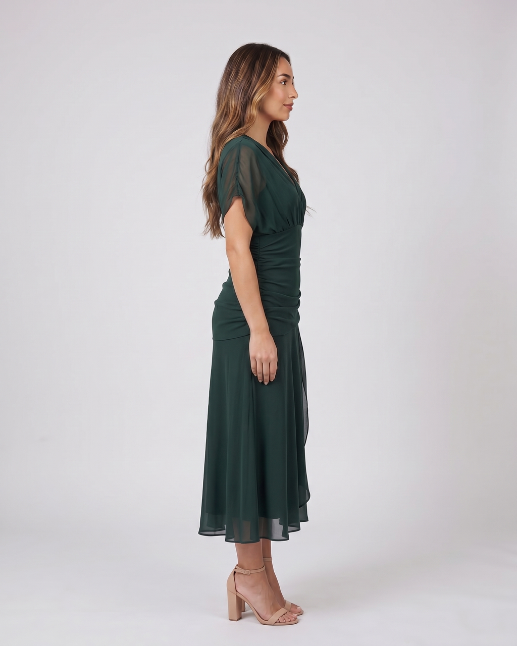 Side view of green off shoulder ruched midi dress