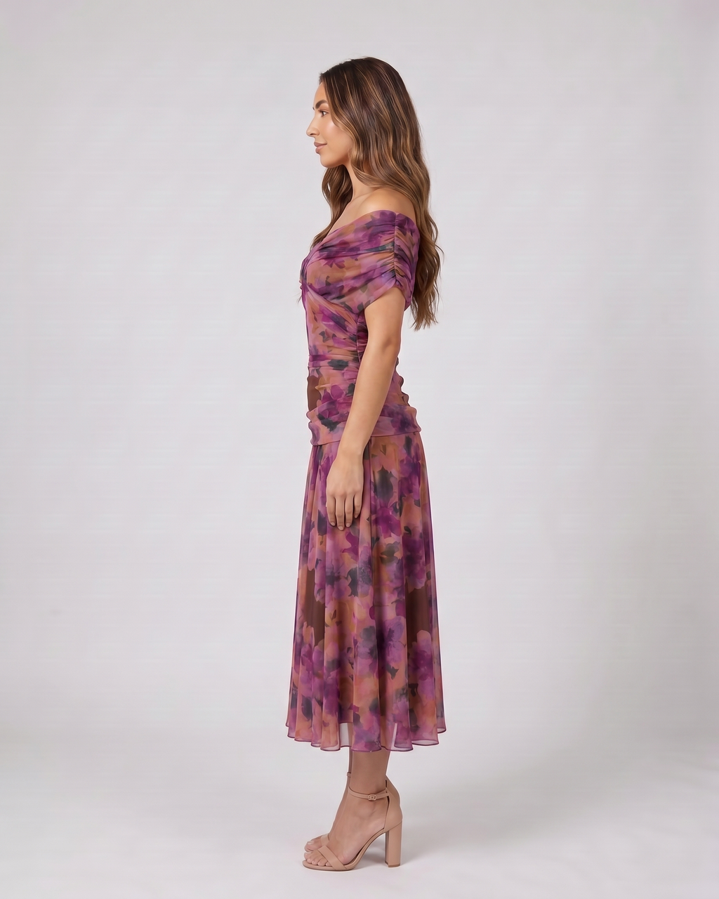 Side view of purple off shoulder ruched midi dress