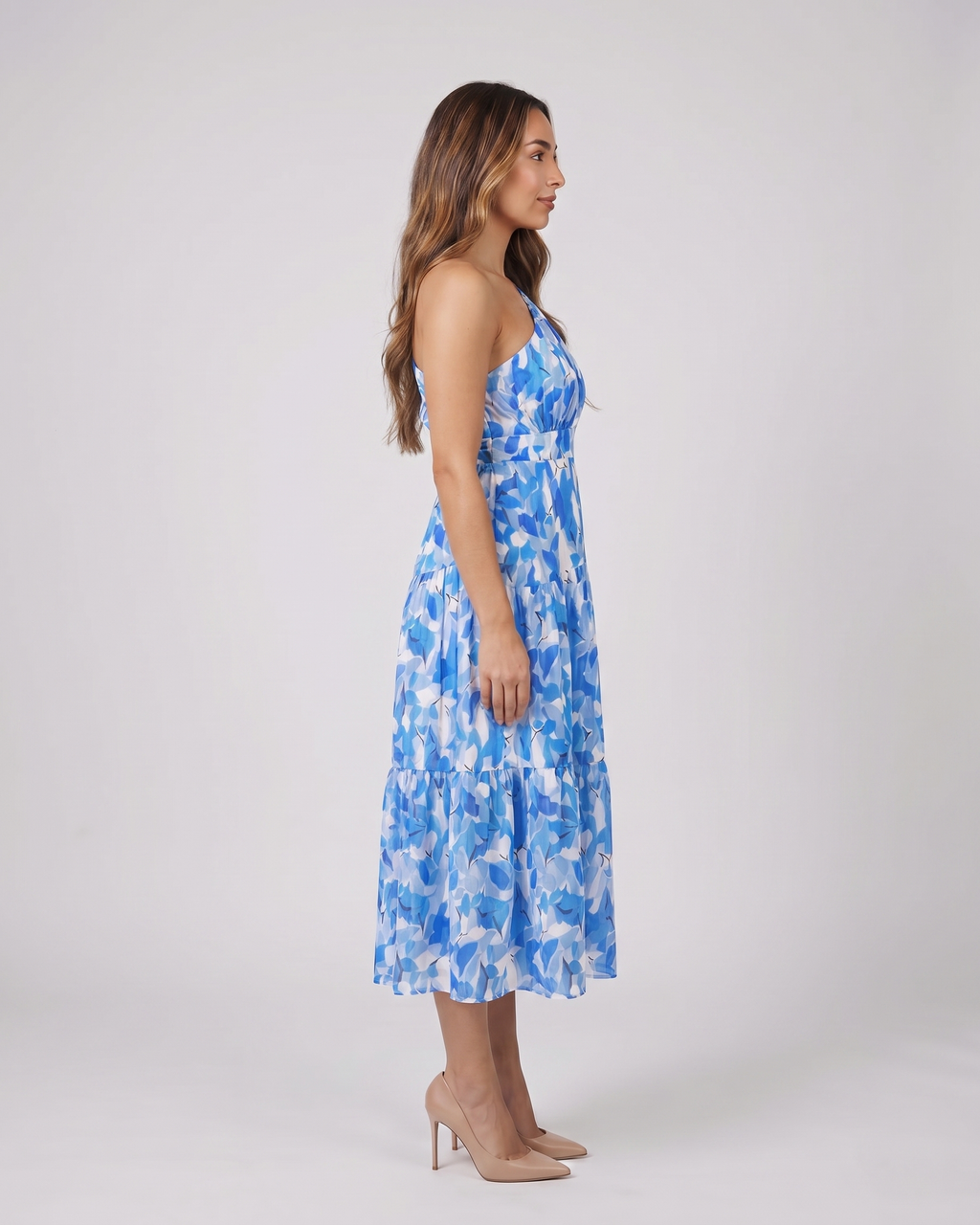 Side view of blue floral one shoulder floral tiered midi dress