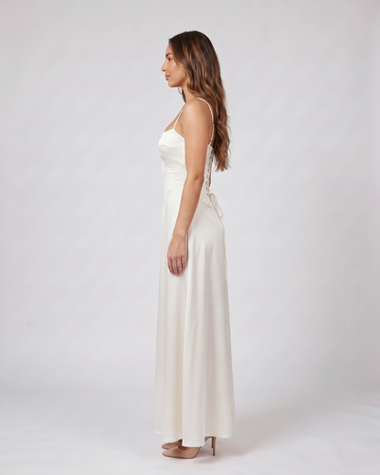 Side view of ivory satin square neck seamed maxi dress