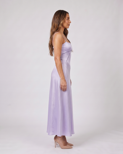 Side view of purple satin square neck seamed maxi dress