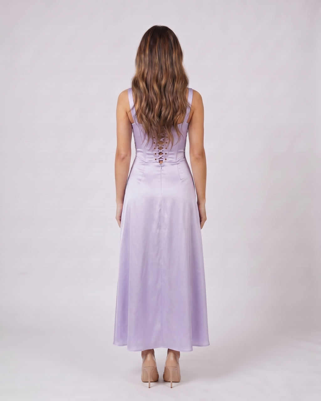 Back view of purple satin square neck seamed maxi dress showing lace-up corset back with metallic grommets