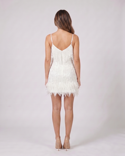 Back view of red sequin v neck fringe mini dress showing v-back neckline with invisible zipper closure