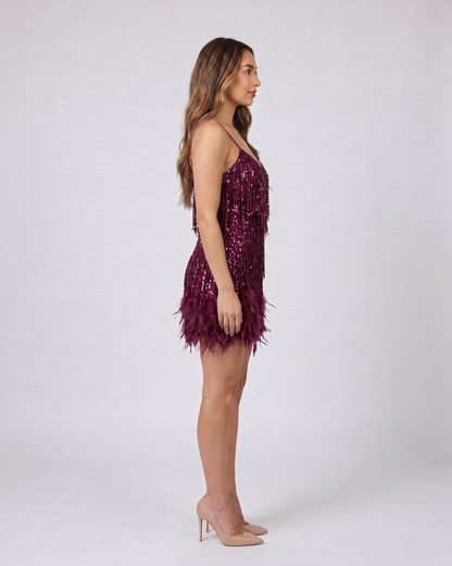 Side view of wine sequin v neck fringe mini dress