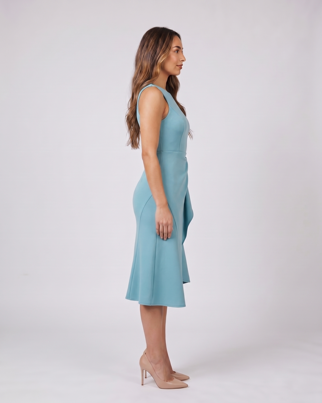 Side view of light blue sleeveless asymmetric draped midi dress