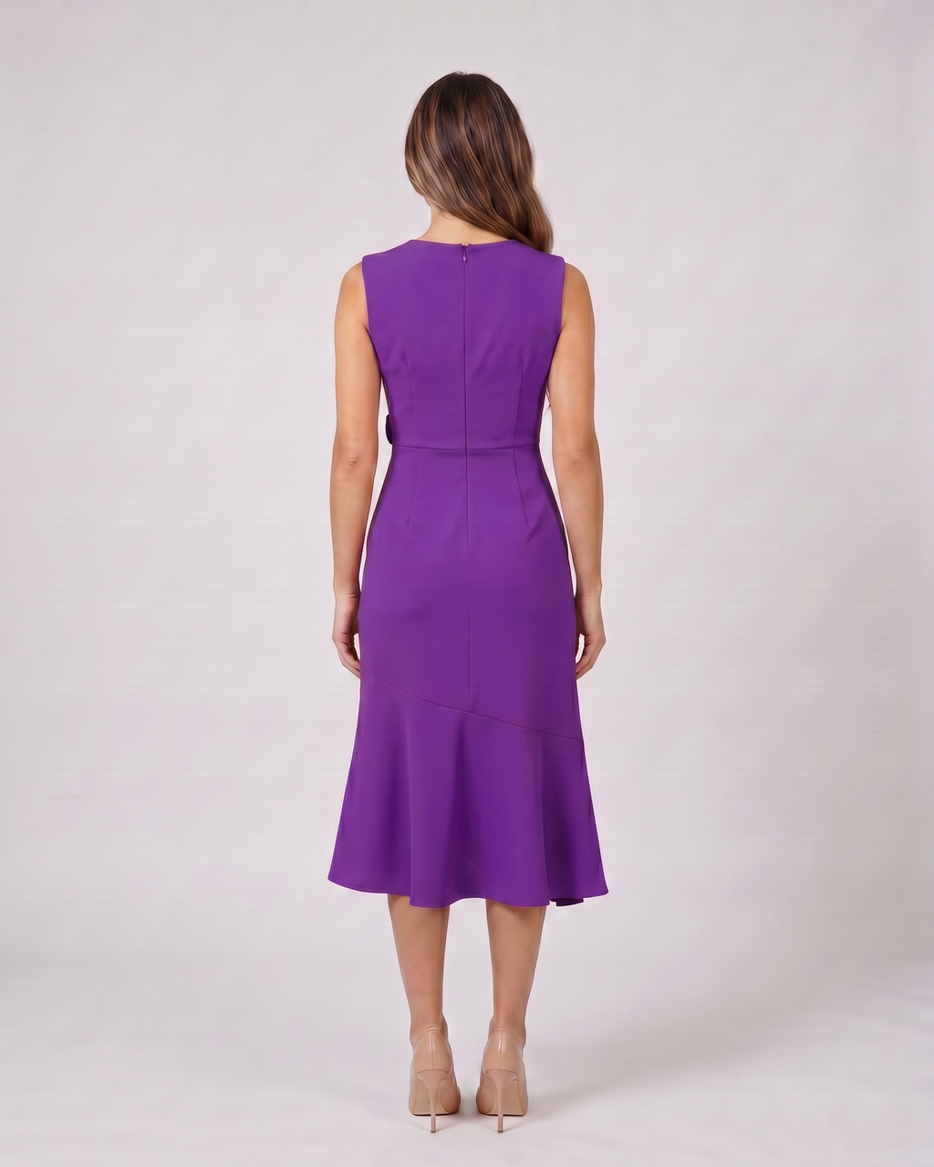 Back view of purple sleeveless asymmetric draped midi dress showing solid back with center back zipper closure