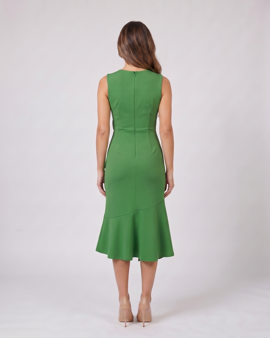 Back view of green sleeveless asymmetric draped midi dress showing solid back with center back zipper closure