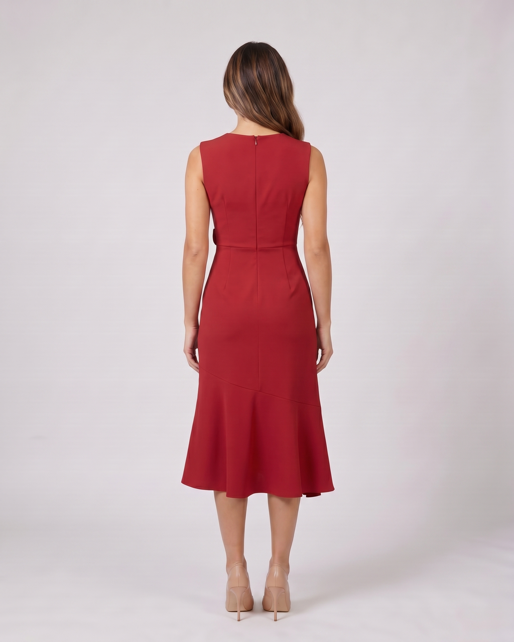Back view of red sleeveless asymmetric draped midi dress showing solid back with center back zipper closure