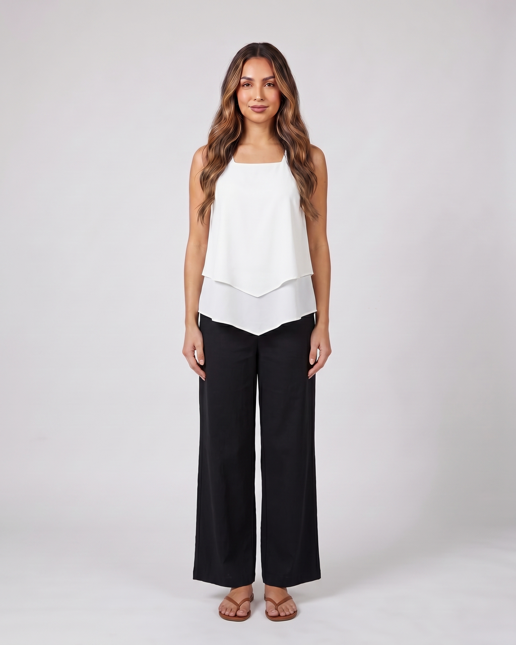 blue sleeveless layered blouse wide leg pants set front view with leaf print and geometric pattern