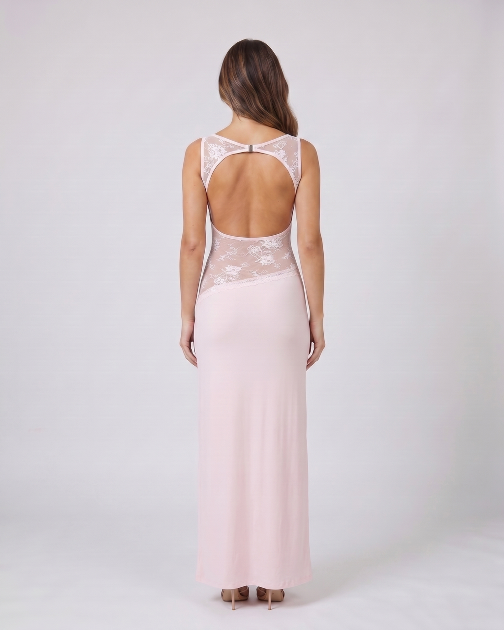Back view of pink sleeveless open back lace maxi dress showing deep open back with horizontal upper back strap and metal clasp closure