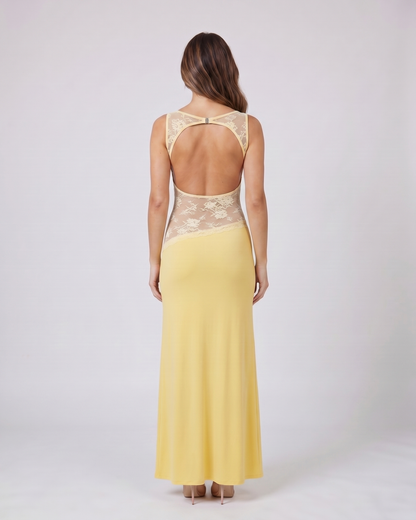 Back view of yellow sleeveless open back lace maxi dress showing deep open back with horizontal upper back strap and metal clasp closure