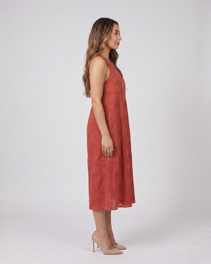 Side view of red sleeveless round neck embroidered midi dress
