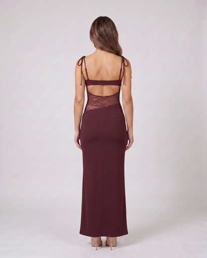 Back view of burgundy square neck lace panel maxi dress showing open-panel back with horizontal mid-back strap and integrated lace detail