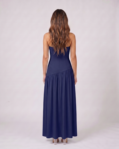 Back view of navy strapless bandeau with front split maxi dress showing solid back with no visible closure details