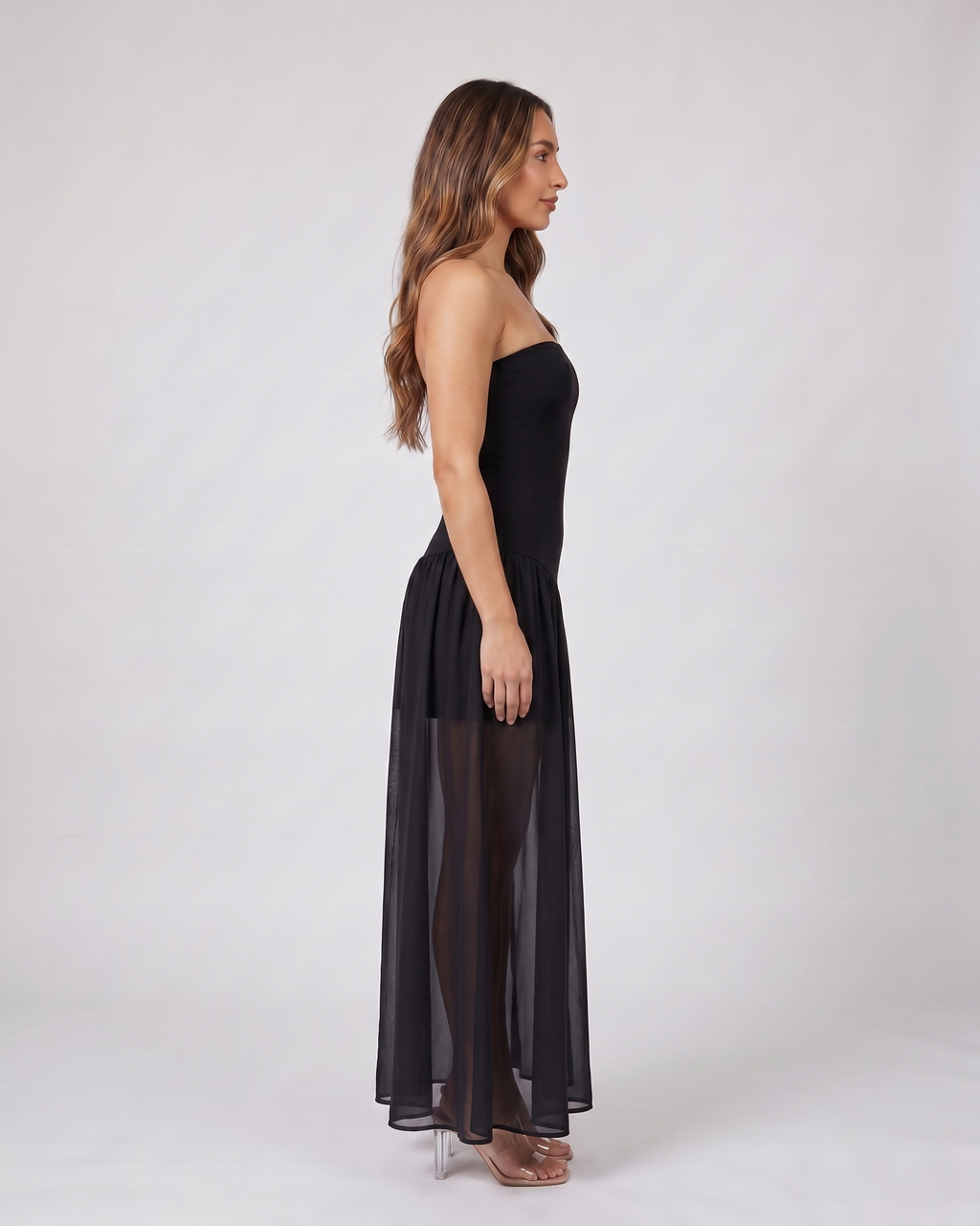 Side view of black strapless bandeau with front split maxi dress
