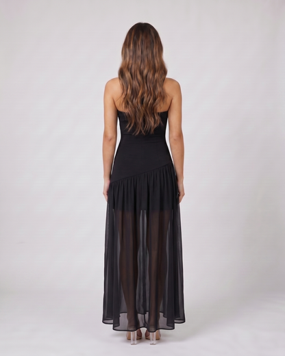 Back view of black strapless bandeau with front split maxi dress showing solid back with no visible closure details