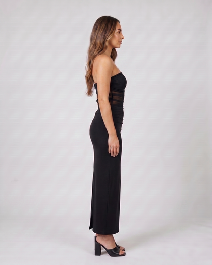 Side view of black strapless bodycon with scarf maxi dress