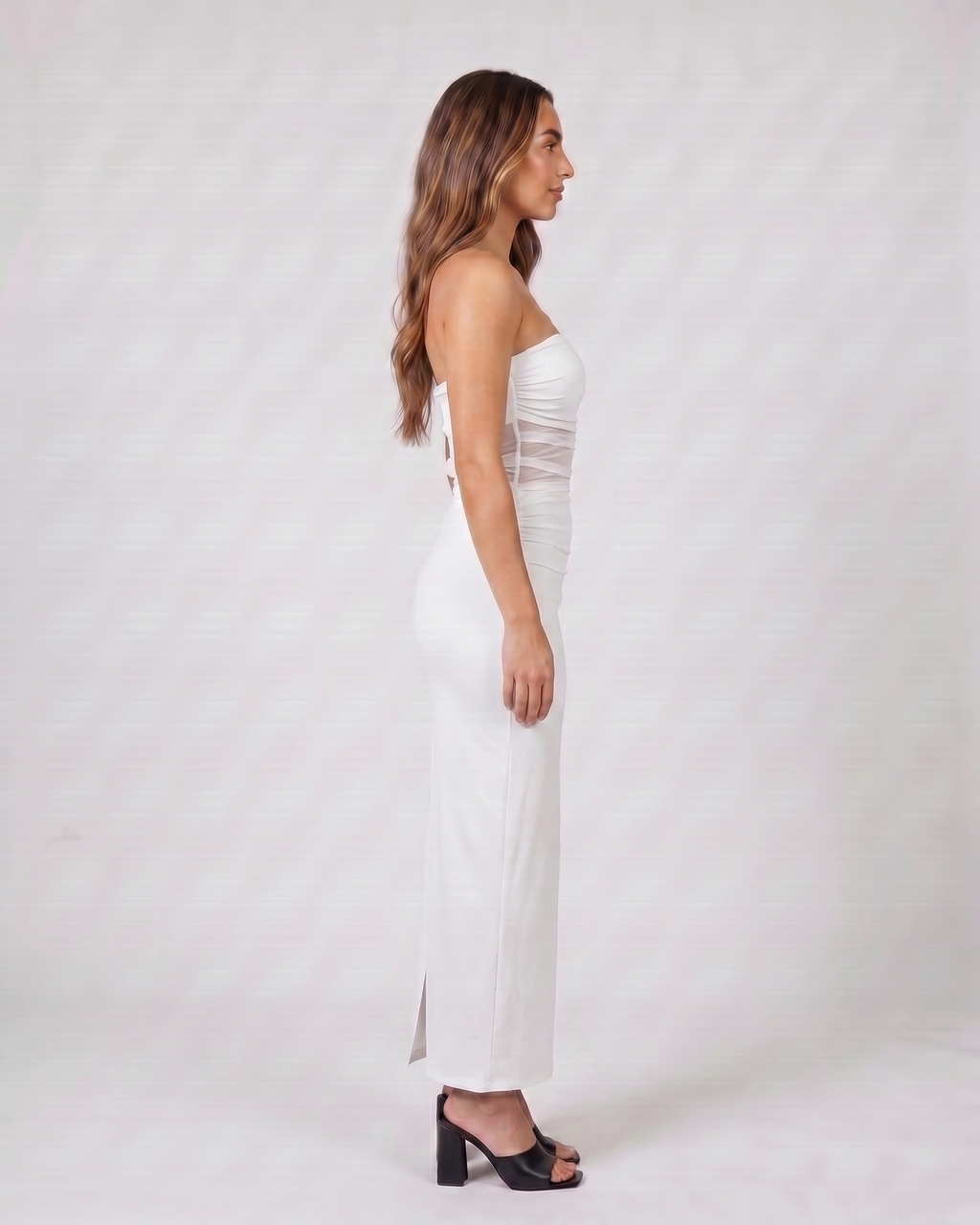 Side view of white strapless bodycon with scarf maxi dress