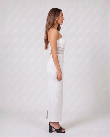 Side view of white strapless bodycon with scarf maxi dress
