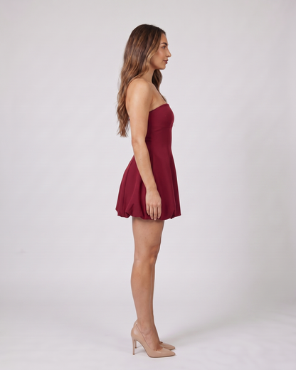 Side view of wine red strapless bubble mini dress