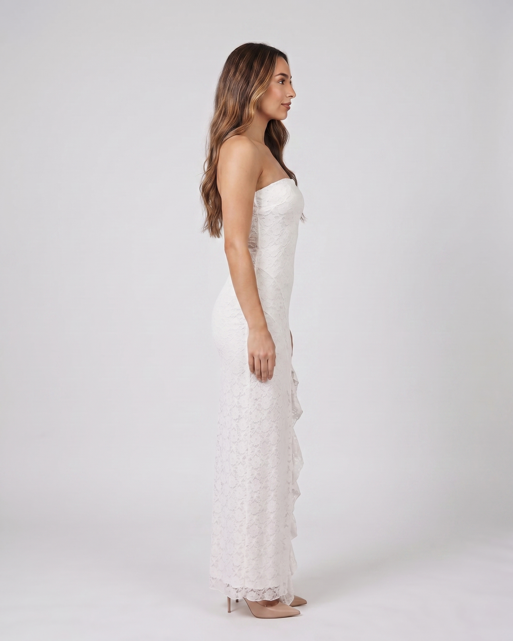Side view of white strapless floral ruffle slit maxi dress