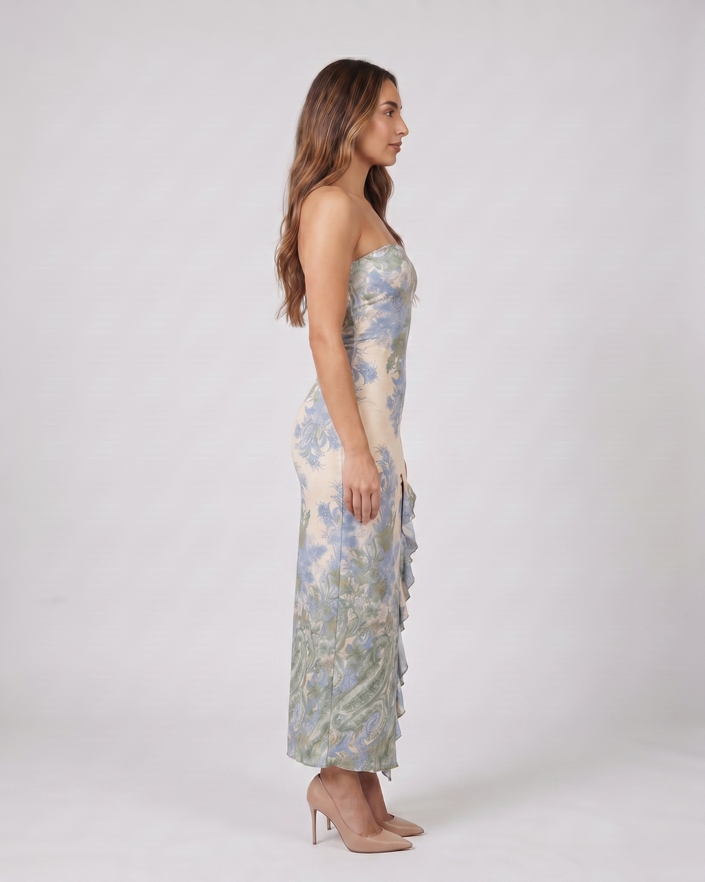 Side view of green strapless floral ruffle slit maxi dress