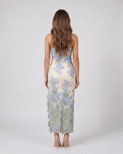 Back view of green strapless floral ruffle slit maxi dress showing solid back