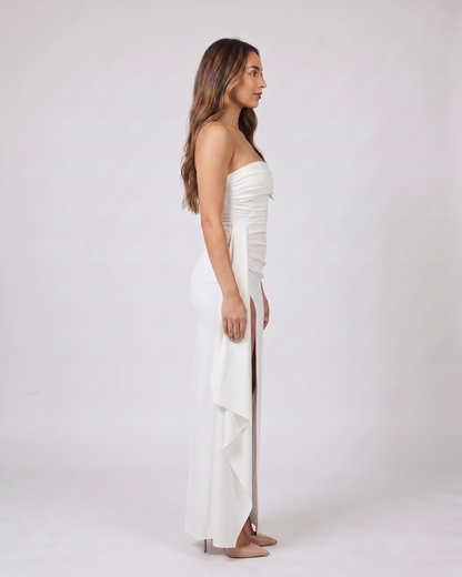 Side view of white strapless ruched thigh split maxi dress