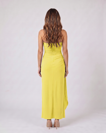 Back view of lemon strapless ruched thigh split maxi dress showing solid back with center back zipper closure