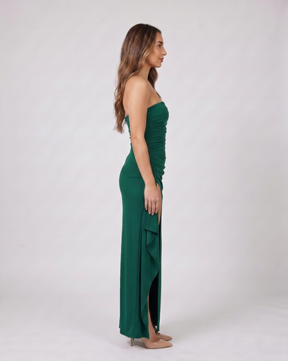 Side view of green strapless ruched thigh split maxi dress