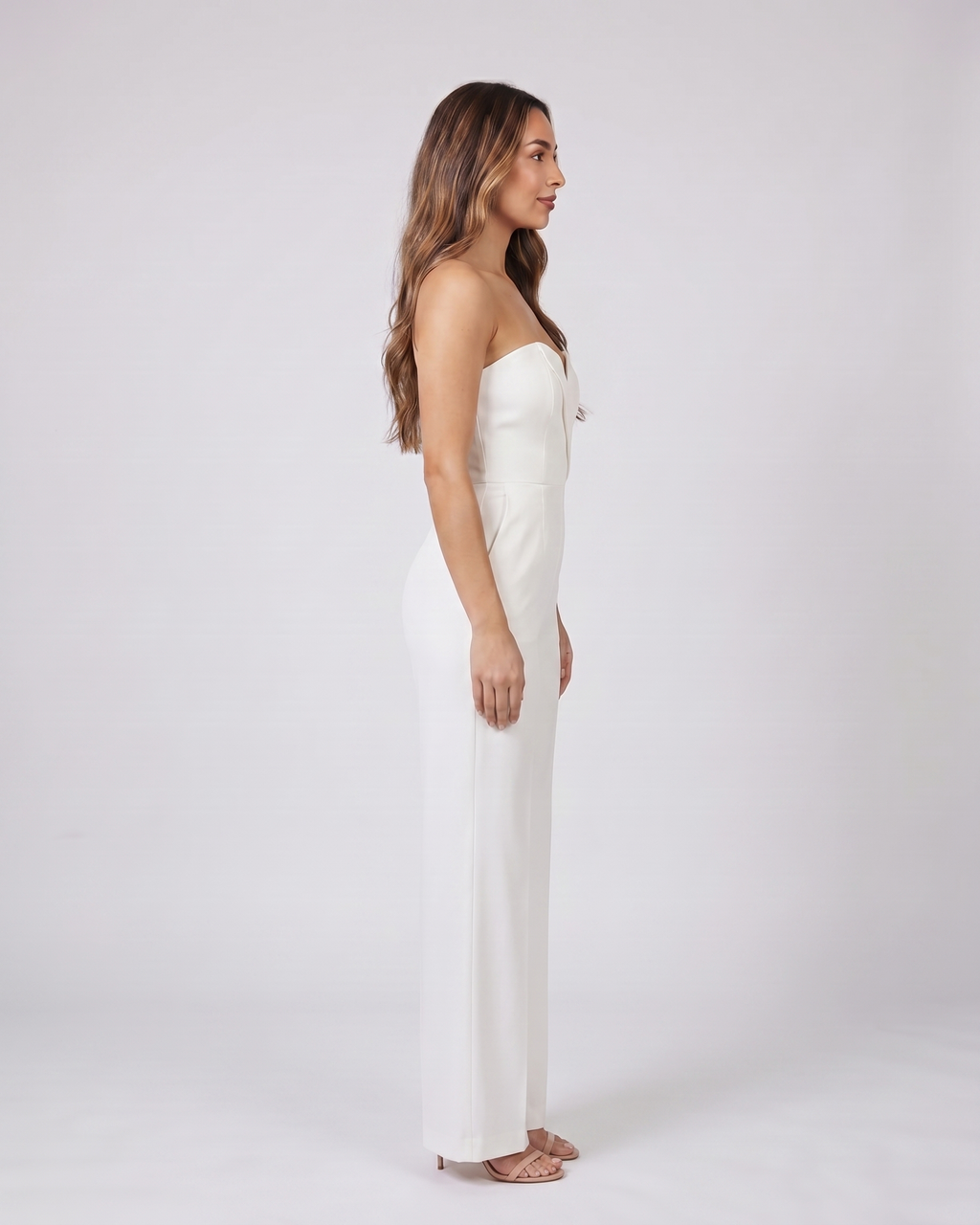 Side view of white strapless sweetheart wide leg formal jumpsuit