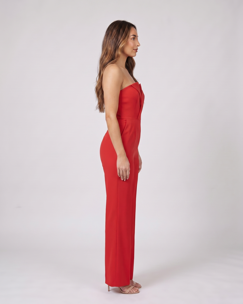 Side view of red strapless sweetheart wide leg formal jumpsuit
