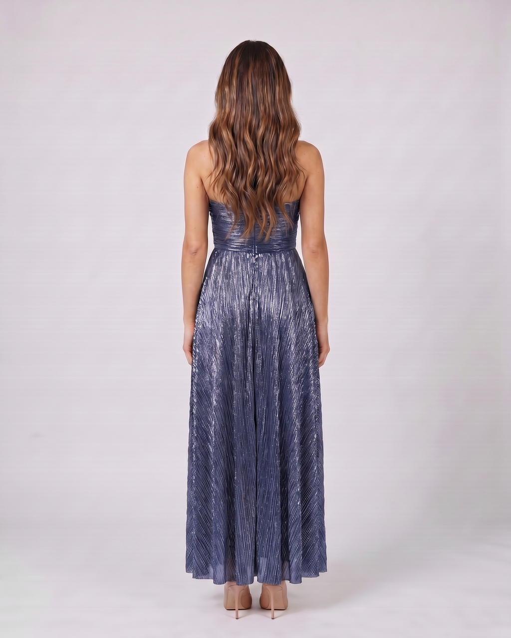 Back view of blue strapless twist front keyhole maxi dress showing solid back